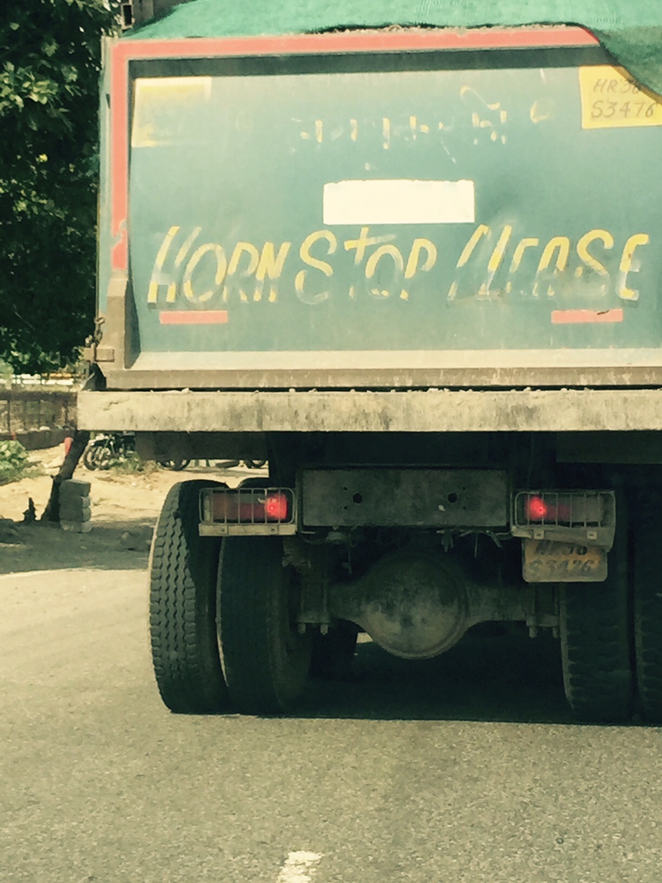 Trucks cutting through Delhi insist that you honk be it day or night (this one is from the state of Haryana).